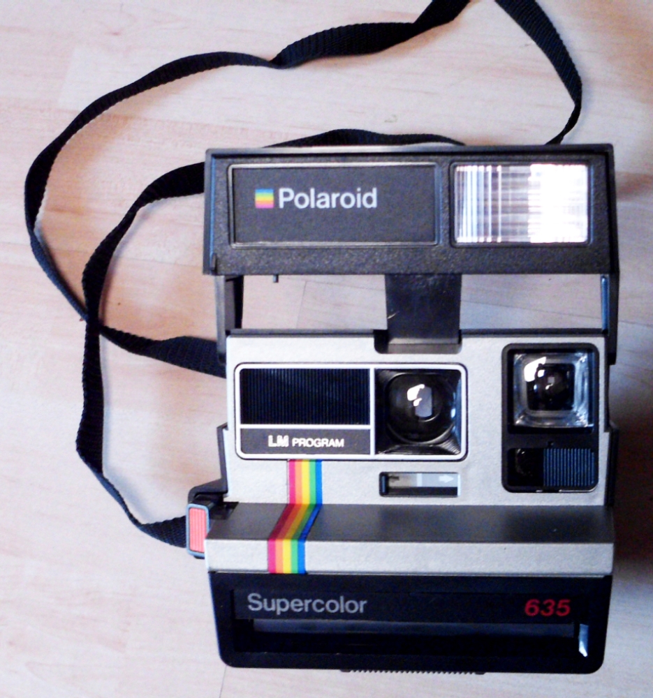 Polaroid Supercolor 635 LM Sofortbildkamera silber mit Regenbogenstreifen